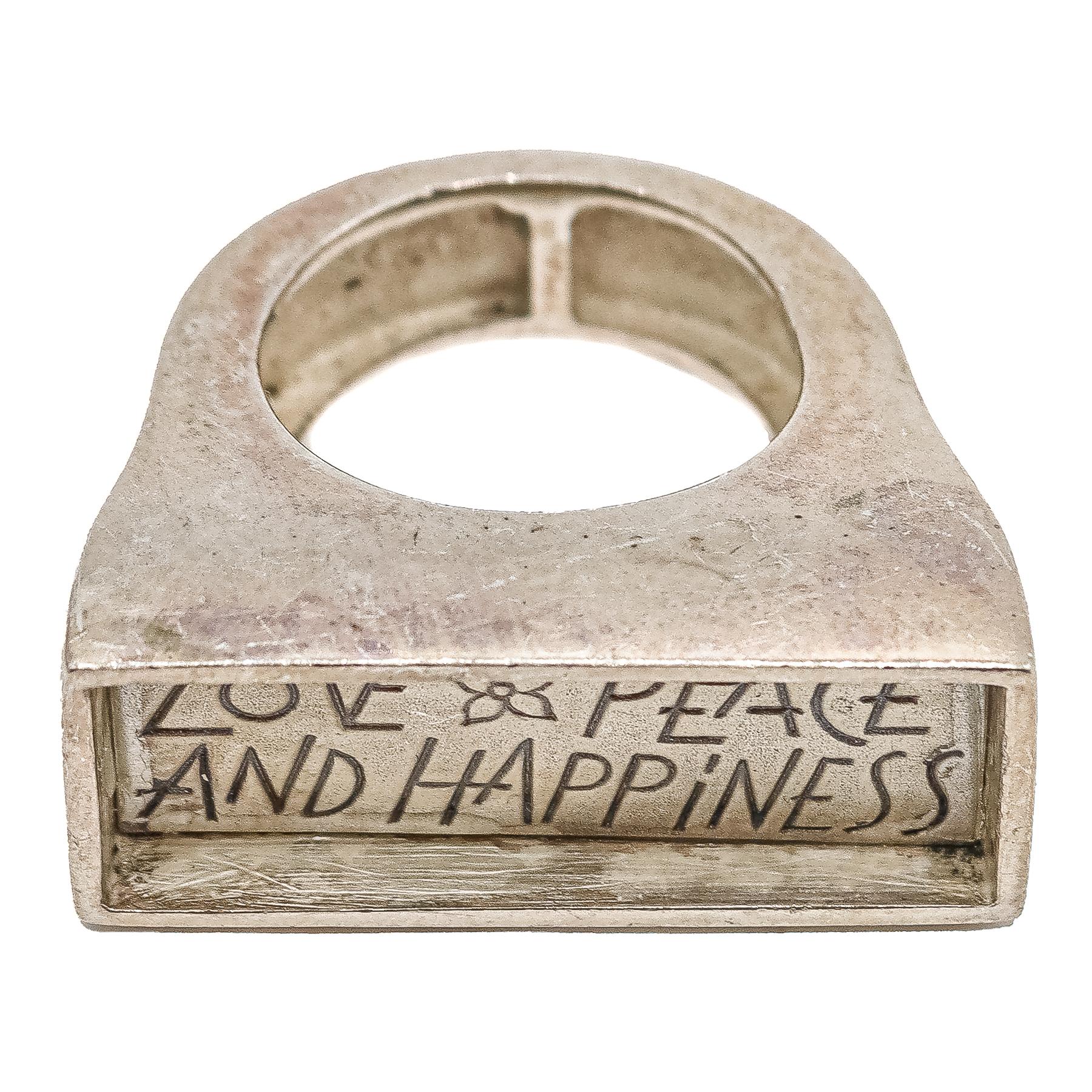 ANILLO DE PLATA "LOVE, PEACE & HAPPINES"