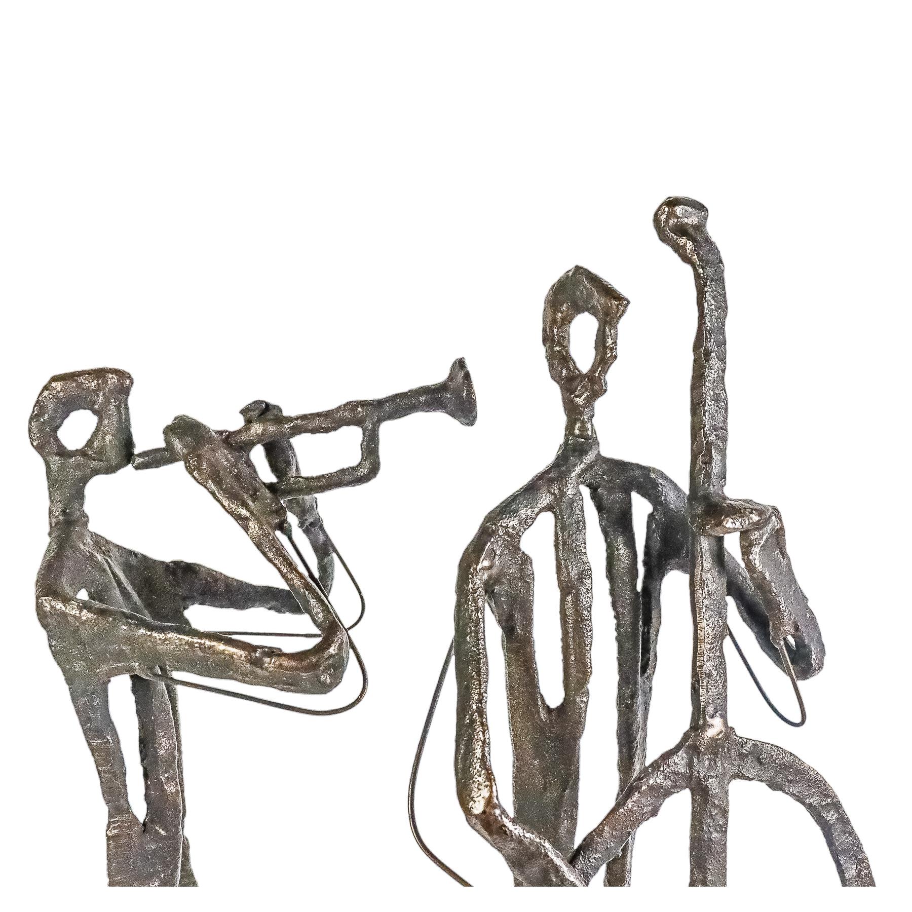 TRES FIGURAS DE MÚSICOS ESTILO GIACOMETTI