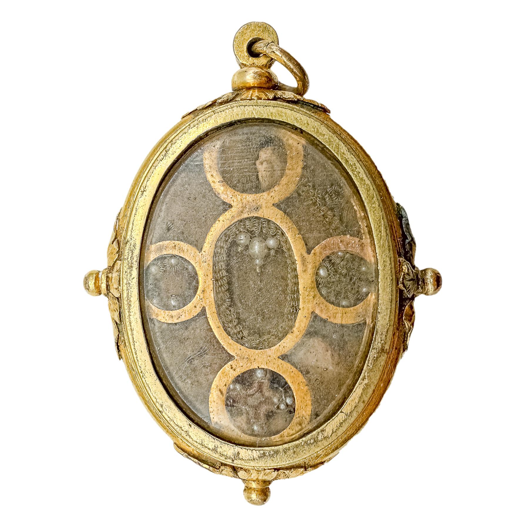 RELICARIO DE METAL SOBREDORADO DEL SIGLO XVIII