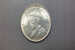 MONEDA Realizada en plata. Una moneda de 1 dólar, Canadá, 1935, Jorge V, (KM# 30). Canto estriado. Marcas: EH. Ceca: Ottawa. Diámetro (mm): 36, Espesor (mm): 2.5.