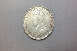 MONEDA Realizada en plata. Una moneda de 1 dólar, Canadá, 1936, Jorge V, (KM# 31). Canto estriado. Marcas: EH. Ceca: Ottawa. Diámetro (mm): 36, Espesor (mm): 2.5.