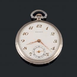 RELOJ DE BOLSILLO MOVADO ,MOVADO Fabricado en níquel. Esfera de porcelana blanca con numeración arábiga en dorado, segundero a las seis, agujas en oro. Sistema remontoir. Diámetro: 48 mm. En estado de marcha.