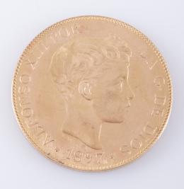 MONEDA DE 100 PESETAS, DE ORO, 1897, ALFONSO XIII, REACUÑACIÓN DE 1962 Realizada en oro rosa. Una moneda de 100 pesetas, España, 1897, Alfonso XIII. Estrella 19 62.