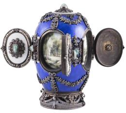 HUEVO RUSO MUSICAL REPRENTANDO LAS CUATRO ESTACIONES, DEL ORFEBRE RUSO FRANÇOIS SEGUIN, EN ESMALTE GUILLOCHÉ Y PLATA, SIGUIENDO MODELOS DE FABERGÉ (RUSIA, S. XIX)
