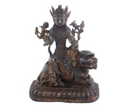 FIGURA EN BRONCE PATINADO DE UN DIOS SOBRE DRAGÓN