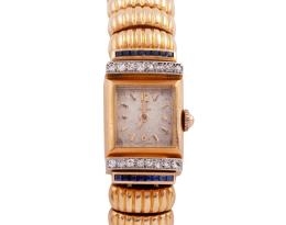 RELOJ OMEGA EN ORO 18KT, BRILLANTES Y ZAFIROS. CUERDA MANUAL