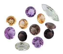 DOCE CUARZOS DE DIVERSOS COLORES Y TALLAS , PESO 68.50 CT