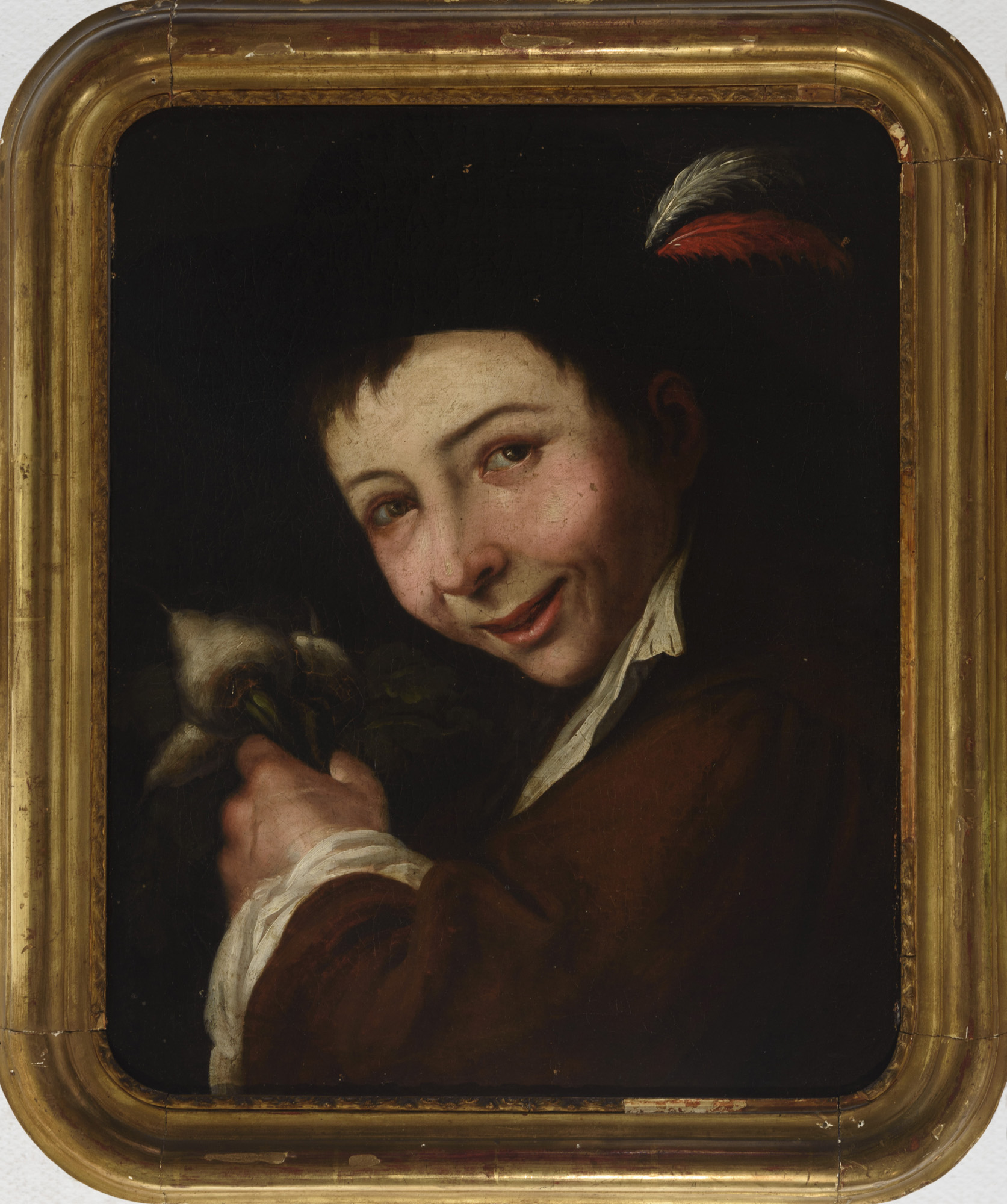 Chico con manojo de nabos