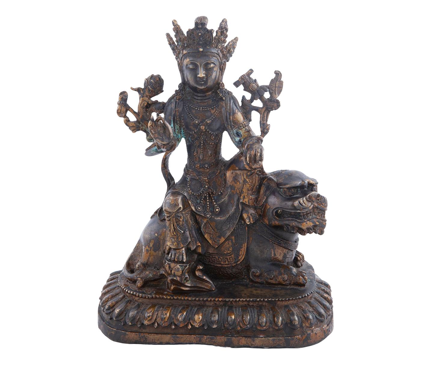 FIGURA EN BRONCE PATINADO DE UN DIOS SOBRE DRAGÓN