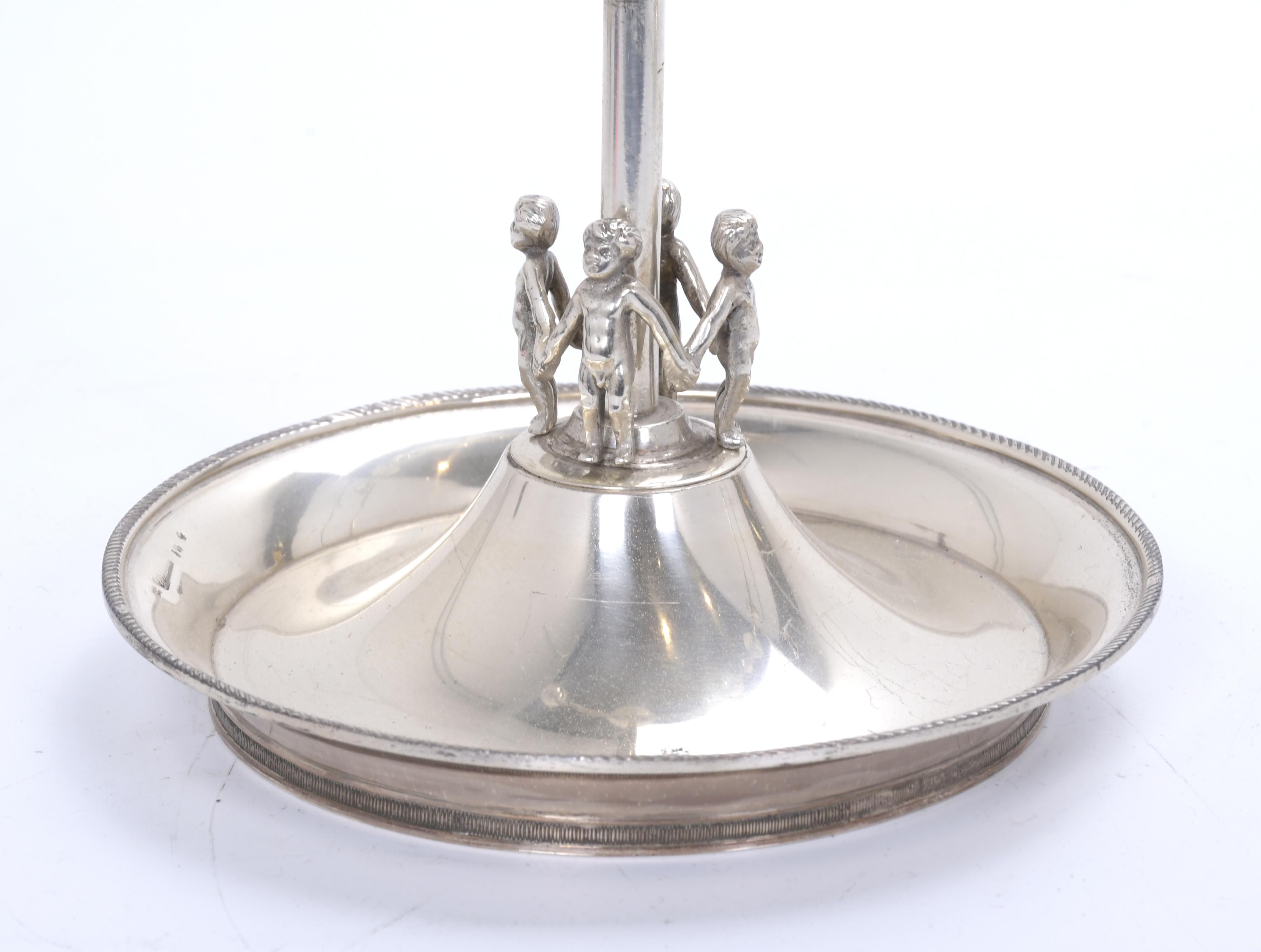 VALENTÍ. Pareja de candelabros en plata, circa 1940.