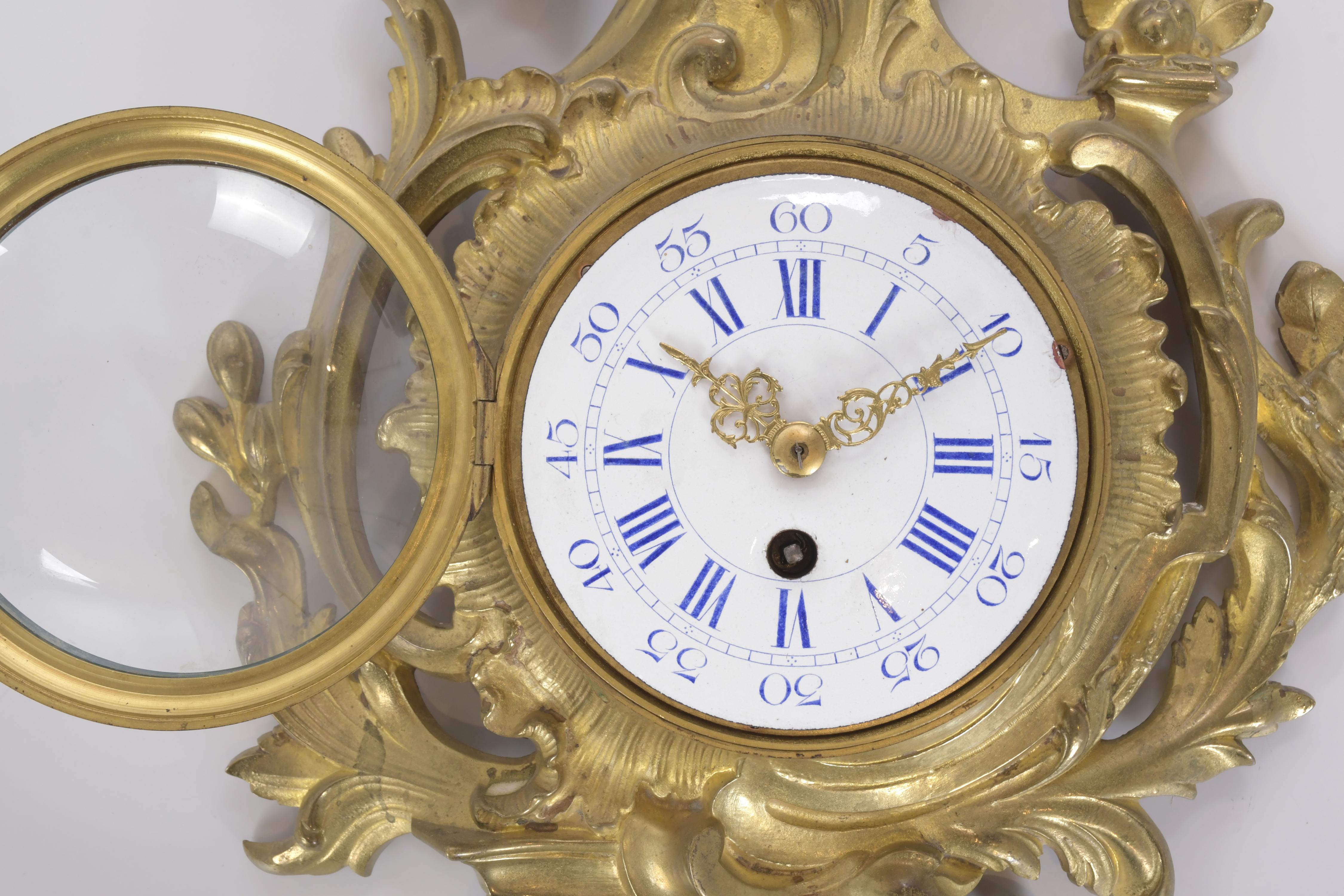 Reloj en cartel estilo Luis XV, siglo XIX. 