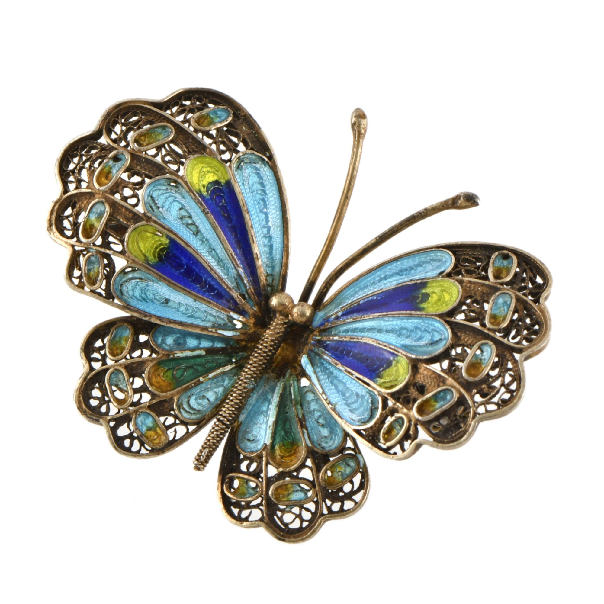Broche en forma de mariposa con esmalte.